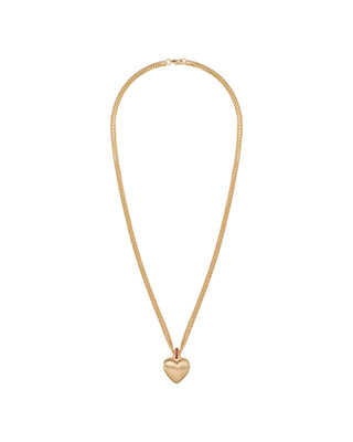 Gold necklace with a heart pendant on a white background