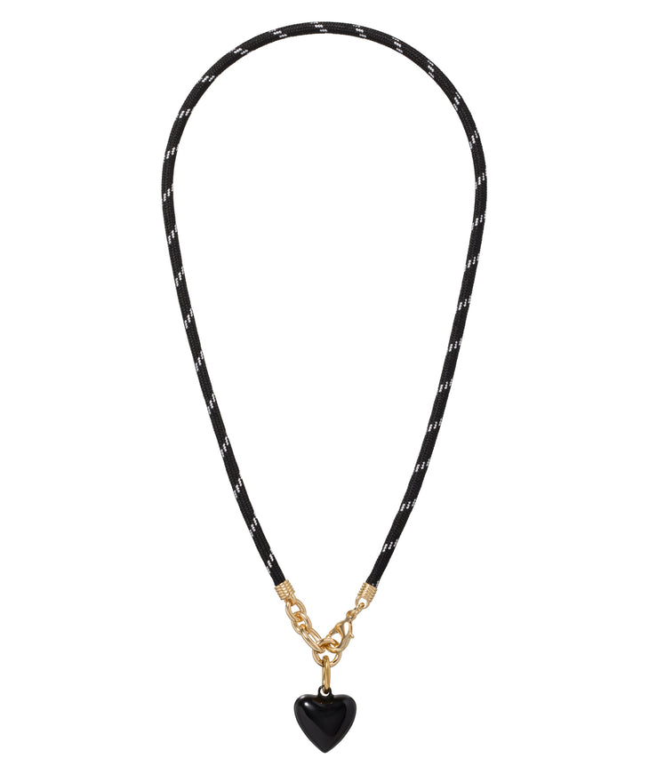 Necklace with black cord and heart-shaped pendant on a white background